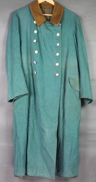 A German style green Serge double breasted greatcoat, the inner pocket with label dated 1939