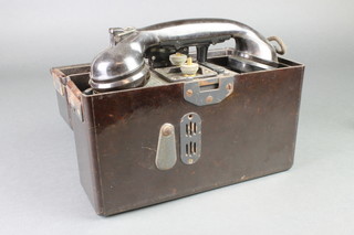 A German field telephone in brown bakelite case 