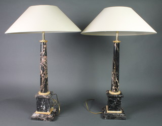 A pair of veined marble table lamps raised on square bases 24"h 