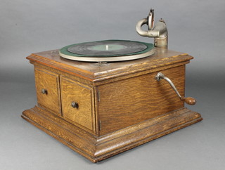 His Masters Voice, a manual gramophone, contained in an oak case