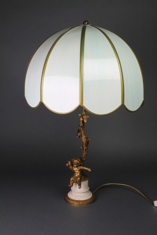 A gilt metal and alabaster table lamp in the form of a seated cherub 23" x 17" 