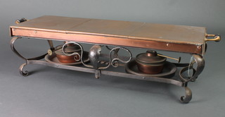 A rectangular wrought iron copper double burner hot plate