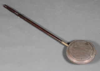 An 18th/19th Century copper warming pan with turned wooden handle 
