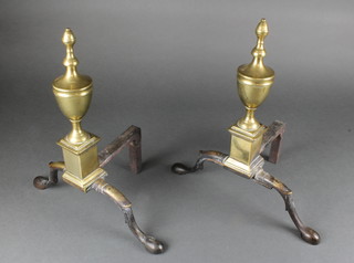 A pair of 19th Century brass and iron fire dogs in the form of lidded urns 
