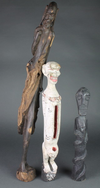 3 various carved wooden figures 29" 