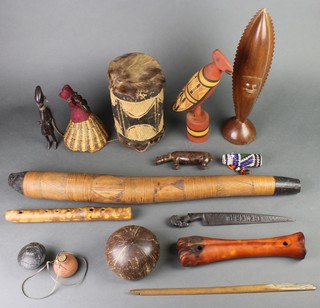 A gourd drum, a carved figure and other curios