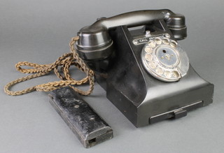 A black dial telephone the base marked 321F S55/3A
