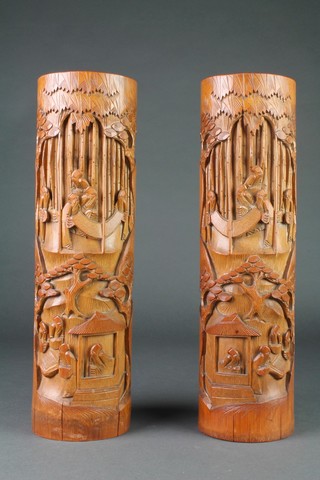 A pair of Japanese carved bamboo vases decorated figures 