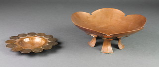 An Art Nouveau style copper leaf shaped dish raised on 5 panel supports 10" together with a circular copper ashtray the edge decorated French coins 