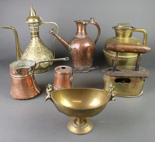 An iron and brass boat shaped box iron, 2 Persian style coffee pots, a cylindrical brass jar and cover, 2 copper jugs with iron handles, an Indian brass boat shaped dish