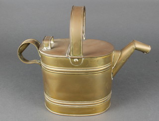 A Victorian oval brass hot water carrier 