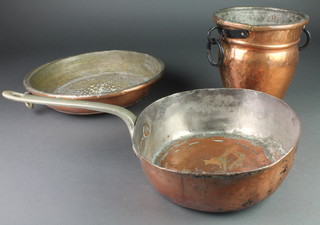 A copper vase with iron drop handles 9", a circular copper cullender 14" and a circular copper saucepan with iron handle 12"