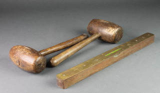 2 19th Century wooden mallets together with an I & D S mulwood brass and mahogany War Office issue spirit level dated 1967