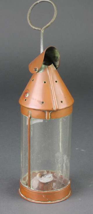 A cylindrical copper and glass lantern 10"