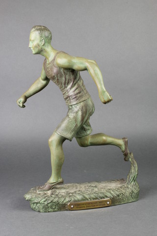 After H Fogene, a well patinated Art Deco spelter figure of a runner, raised on an oval base 15" 