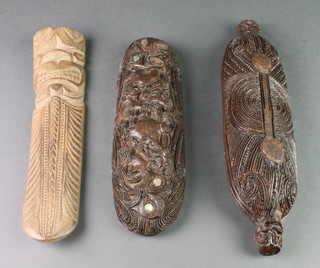 A Maori style resin boat shaped jar and cover 15" and an arch shaped totem style carving 