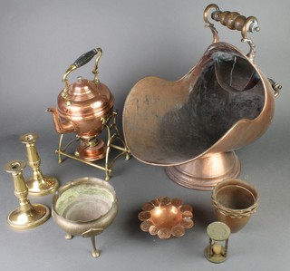 A copper and brass spirit kettle, pair of brass candlesticks, coal scuttle an Art Nouveau cylindrical metal jardiniere raised on panelled supports, 4 small copper jardinieres and a copper ashtray decorated coins 