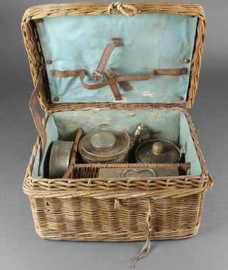 A 1920's chromium plated picnic set comprising stove, teapot, sandwich box, twin compartment tea caddy contained in a wicker hamper 