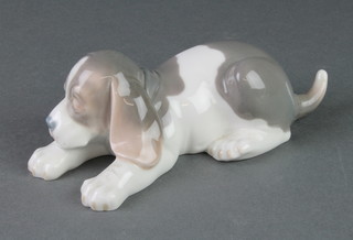 A Lladro figure of a reclining hound 7" 