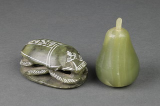 A carved green hardstone scarab seal 4" and a carved green hardstone model of a pear 