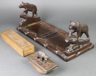 A 19th Century carved Swiss expanding bookends decorated bears 7", ditto blotter and a rectangular wooden pencil box 