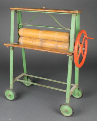 Triang, a childs metal and wooden mangle 