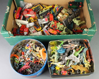 2 metal boxes containing a collection of various plastic military and animal figures together with a collection of various toy cars 