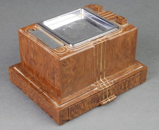 An Art Deco brown bakelite and chrome cigarette dispenser ashtray
