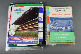A box of various FA Cup and League Cup Final and Semi-Final programmes