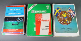 A box of International football programmes