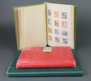 A green stock book of various mint and used GB stamps, a Sefton green album of various used world stamps and a ditto red album of GB stamps 