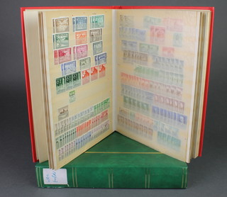 A green stock book of various German Empire used stamps 1870 - 1932, together with a stock book of German stamps 