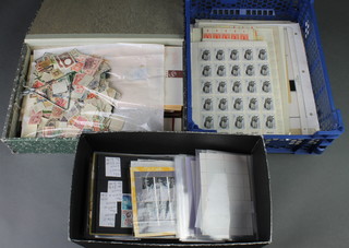A quantity of loose stamps contained in a plastic crate, a shoe box and a box file