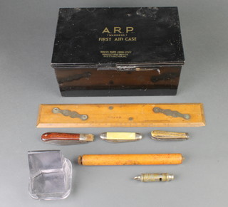 A Second World War ARP Wardens first aid tin with hinged lid, a parallel ruler by W H Harling Ltd, 3 pocket knives etc 