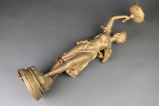 A gilt painted spelter lamp in the form of a standing lady with torch 22", the base f