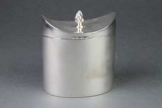 An Edwardian oval silver plated tea caddy with concave lid and flame finial