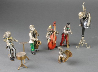 A Sorini silver and bronze band comprising 4 clown musicians and a monkey playing cymbals together with a coat stand, coat, hat and scarf 