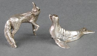 A silver figure of a fox and a ditto of a seal 50 grams