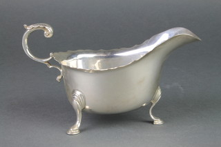 A silver sauce boat with S scroll handle on hoof feet Birmingham 1986 246 grams