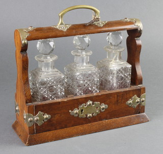 An Edwardian silver plated mounted mahogany 3 bottle tantalus 9" 