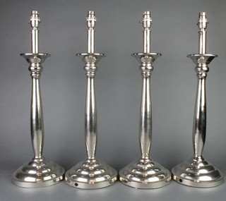 A set of 4 silver plated baluster table lamps 22" 