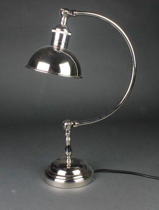 A silver plated students lamp