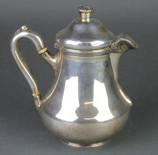A George III silver baluster hotwater jug with hinged lid and floral finial, the scroll handle with ivory resistors London 1835,476 grams