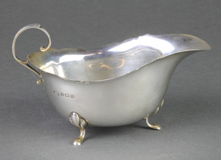 A silver sauce boat with S scroll handled on pad feet Birmingham 1930, 86 grams