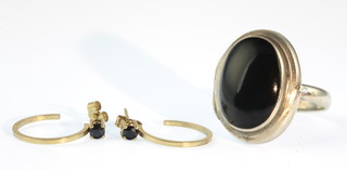A pair of 9ct gold hoop earrings and a silver and onyx ring 