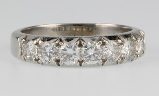 A platinum 7 stone diamond half eternity ring, size Q 1/2