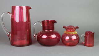 A Victorian cranberry glass jug 10", 2 others and a baluster vase 