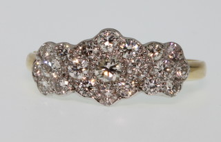 An 18ct white gold triple diamond cluster ring, size Q, 