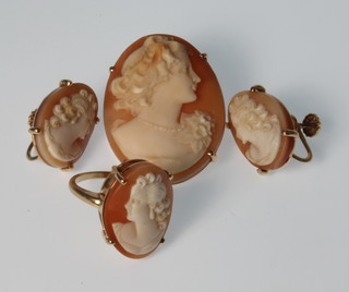 A 14ct yellow gold cameo suite comprising pendant brooch, dress ring and ear clips 