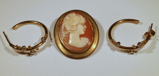 A pair of gold diamond set half hoop earrings and a 9ct gold cameo brooch 
